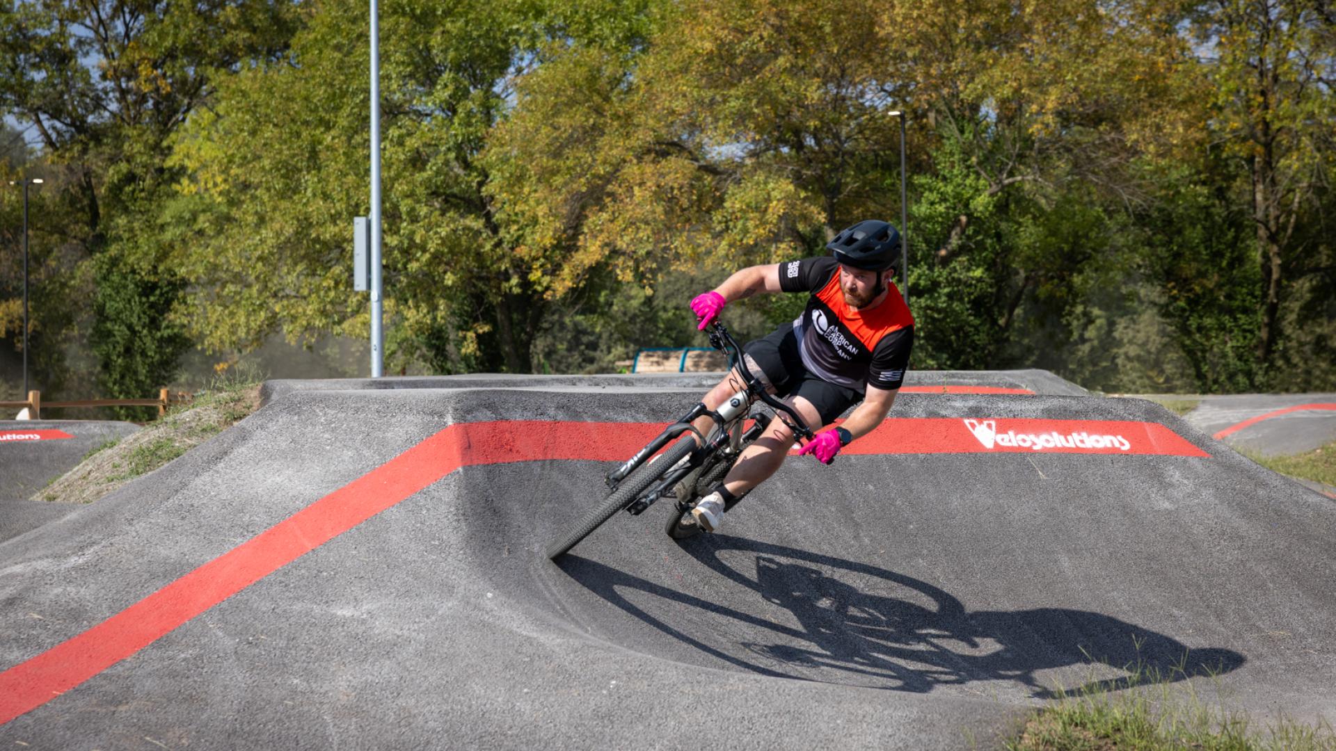 Rider on Velosolutions Pump Track at MOmentum Bike Park
