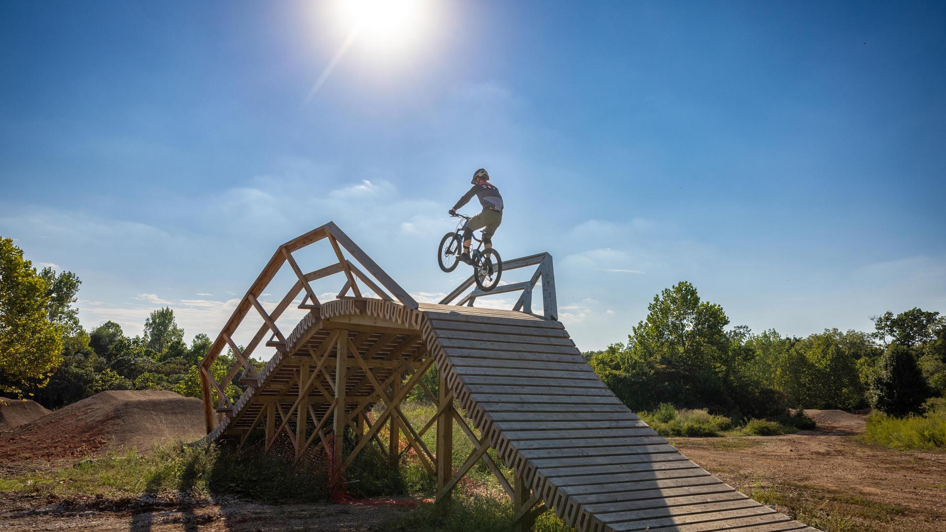 Sun flare as rider jumps over 3rd Law Flyover