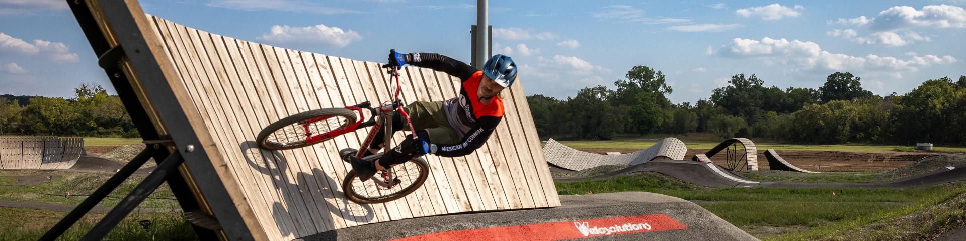 Pump track rider on banked curve