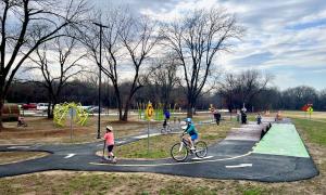 Kids riding bicycles through Traffic Garden at MOmentum Bike Park