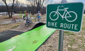 Bike Route sign and practice bike lane in playground area