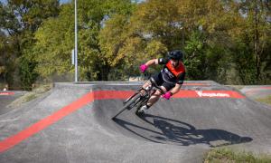 Rider on Velosolutions Pump Track at MOmentum Bike Park