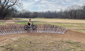 Talladega banked berm curve in kids bicycle playground